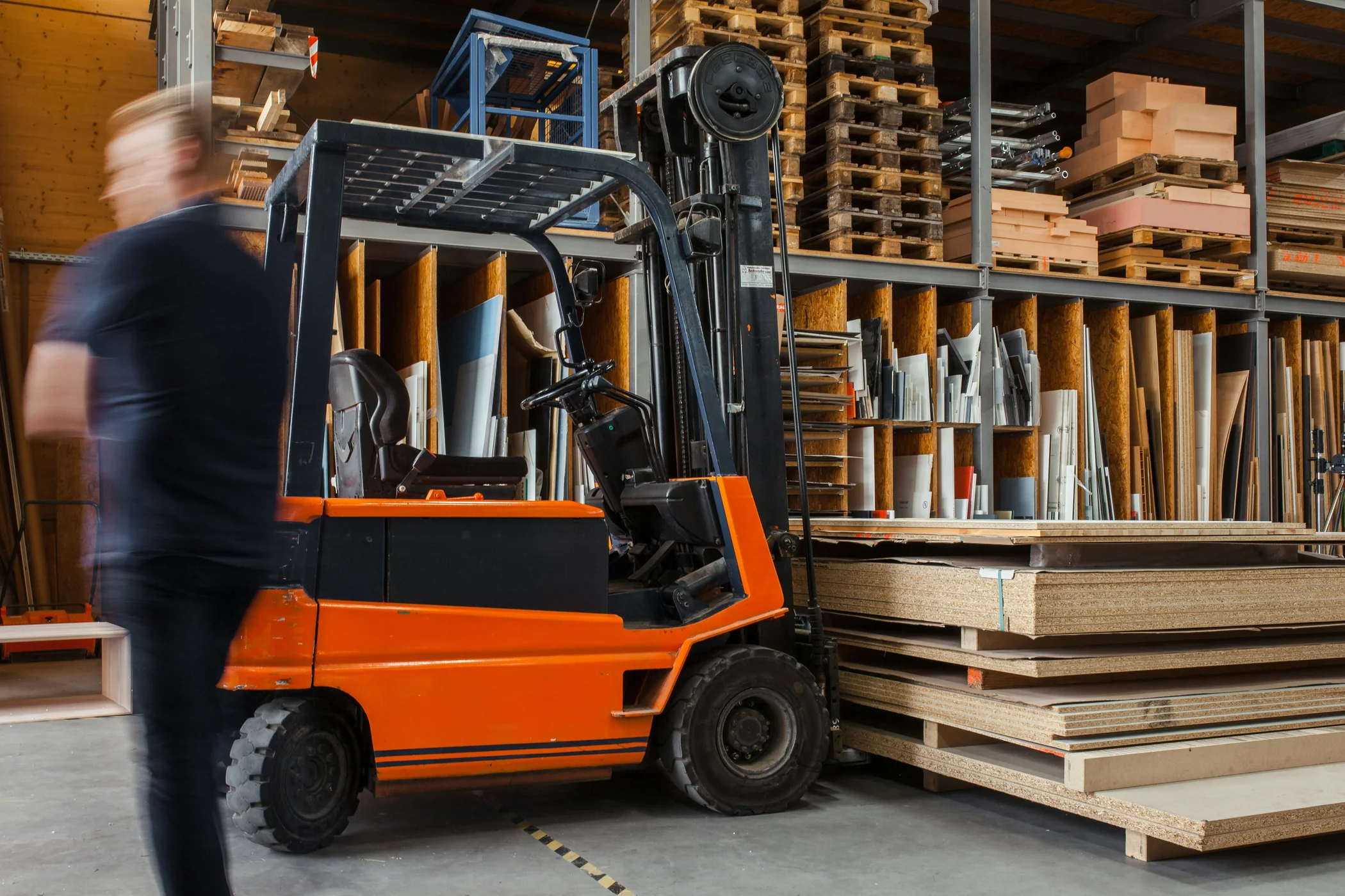 Forklift operating in a warehouse